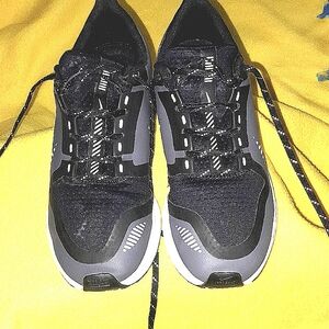 Woman Black and Gray Athletic Shoes